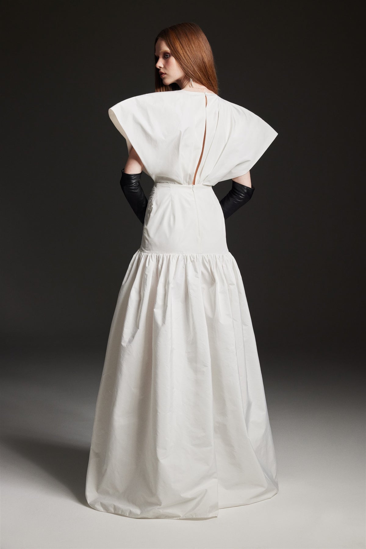 White taffeta gown with sculptural sleeves