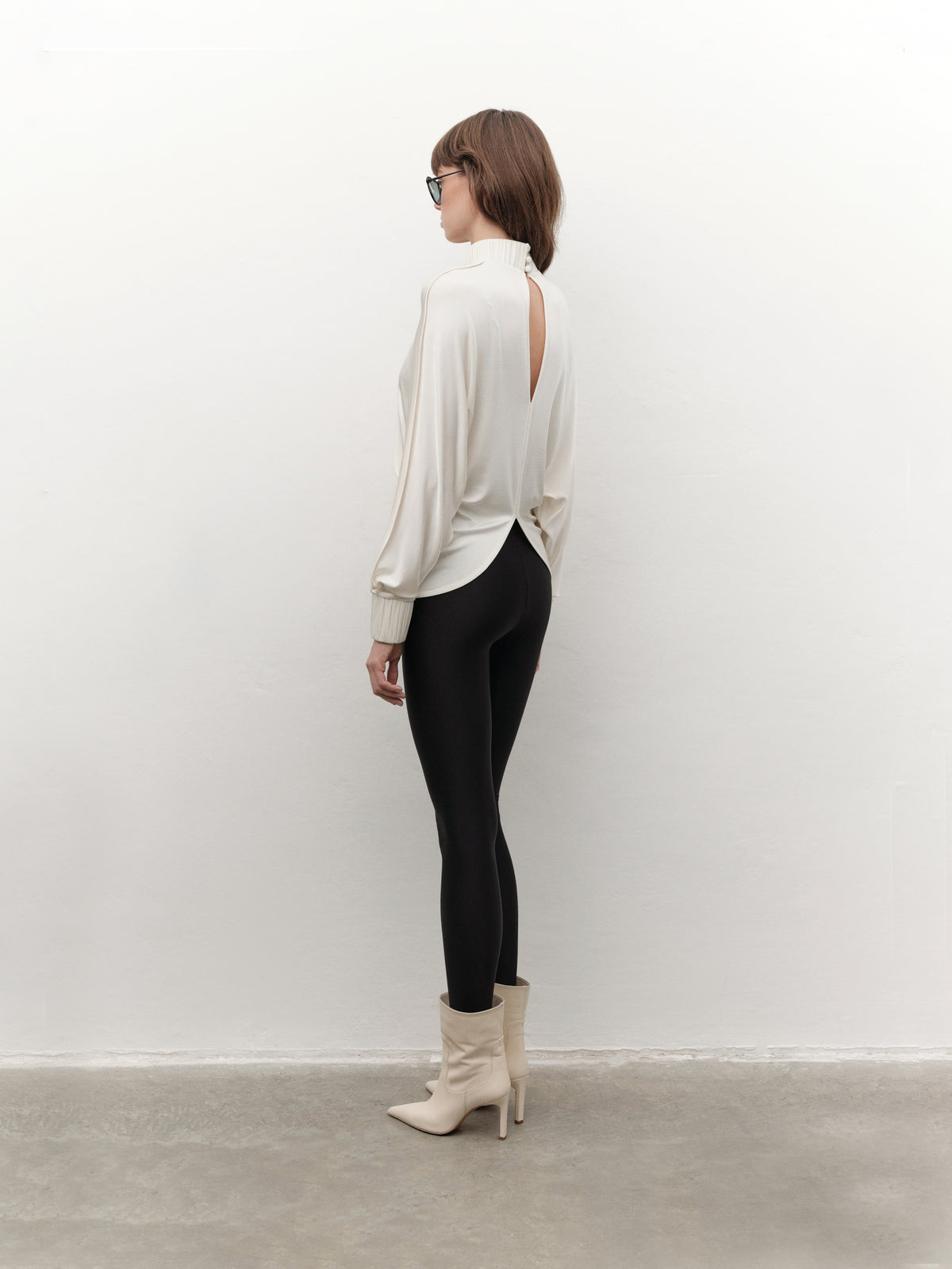 Drape-detail high-neck batwing sleeve blouse in cream